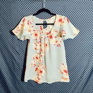 Star Vixen - Women's light blue blouse with pink floral pattern. New. Size - S
